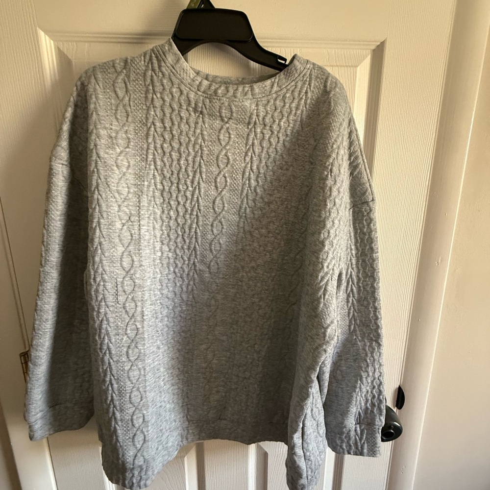 96% Polyester, 4% Spandex pullover sweater